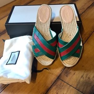 Gucci Malaga Kid Paquita slides Emerald and Red. The top is leather.